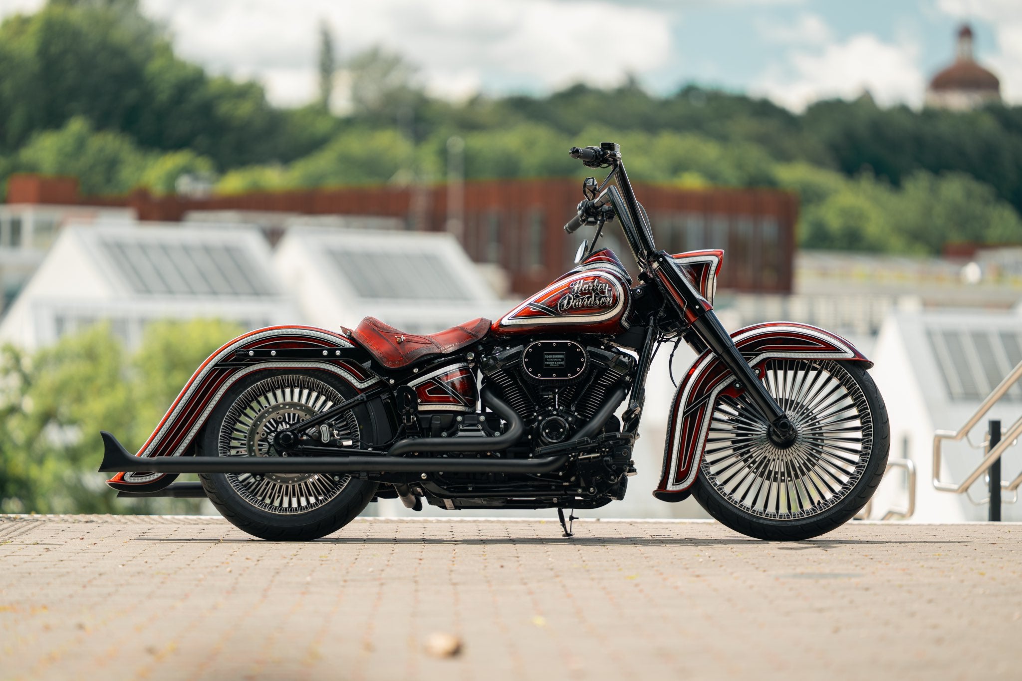Chicano style Harley with custom wheels and cholo style fenders