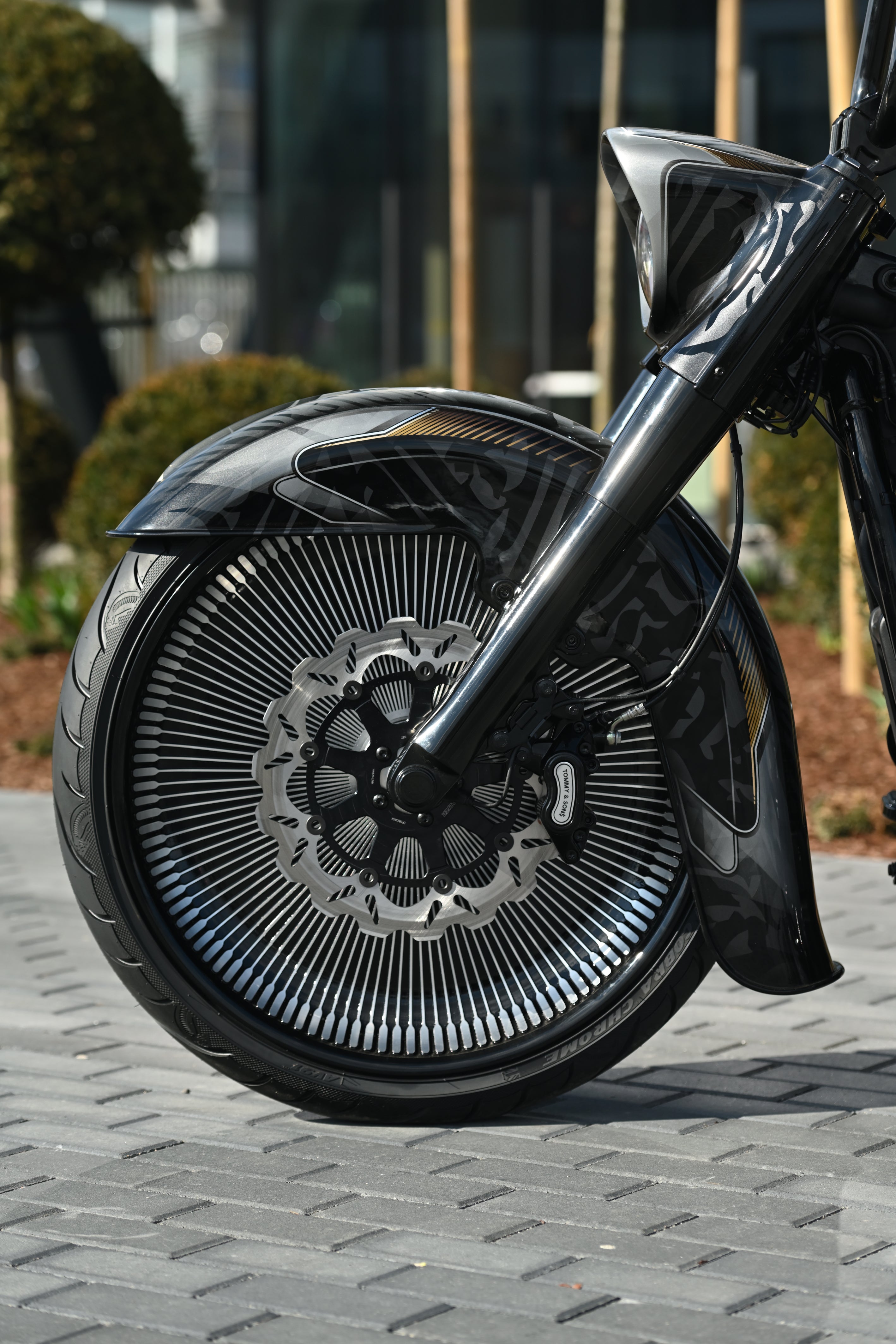 Chicano style front fender for Harley Davidson Softail 23" wheel on motorcycle close up