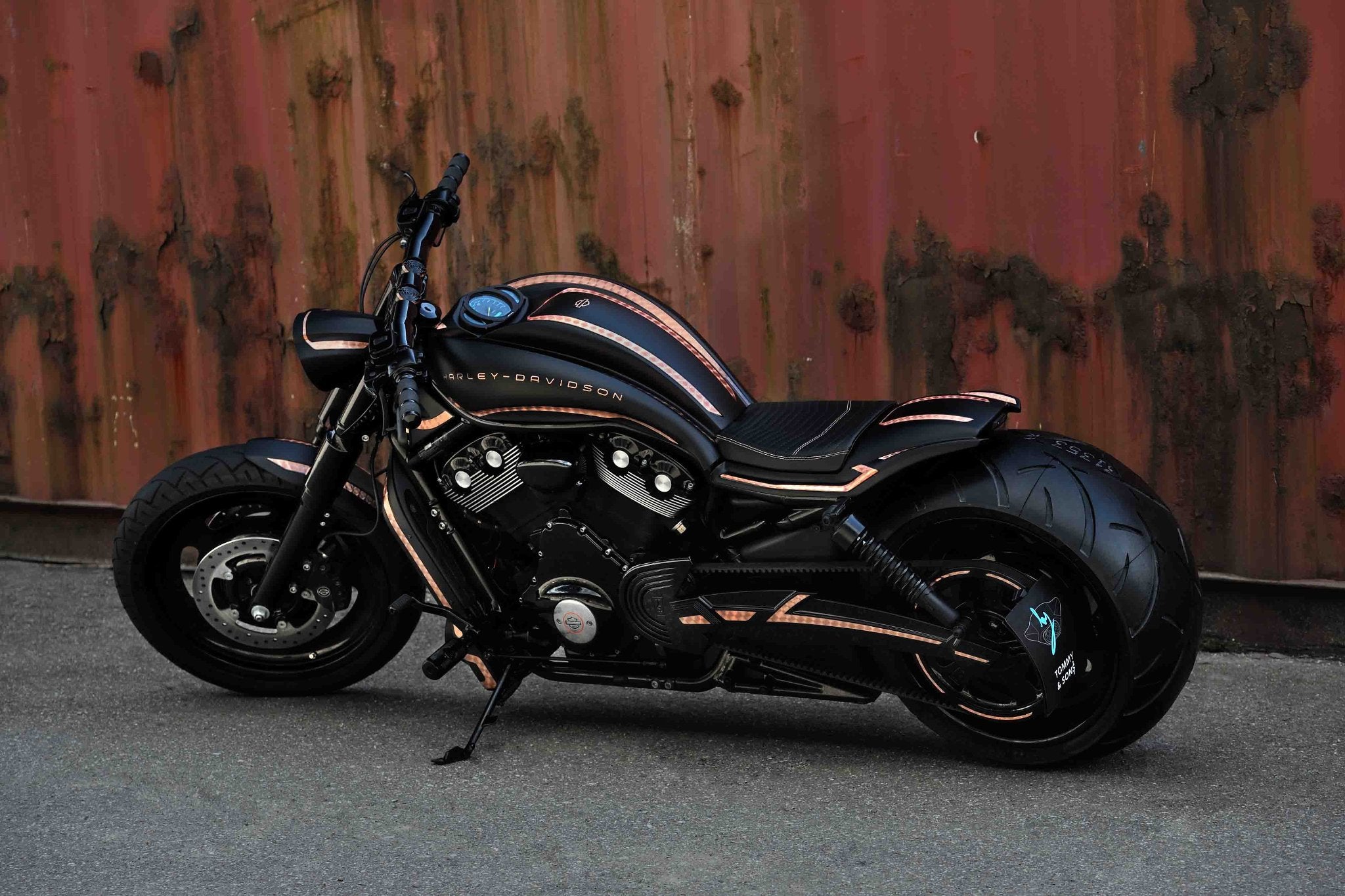 V-Rod Night Rod Harley Davidson with custom Photon series body kit photographed from the side standing next to a container.
