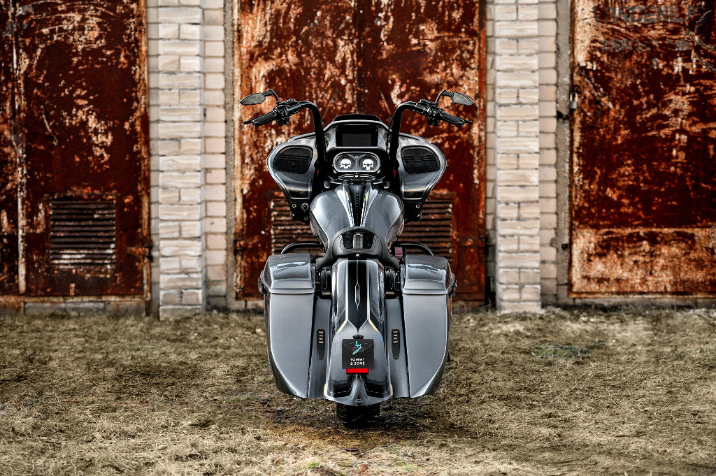 Harley davidson road glide custom pictured from rear with bagger rear fender and saddlebags