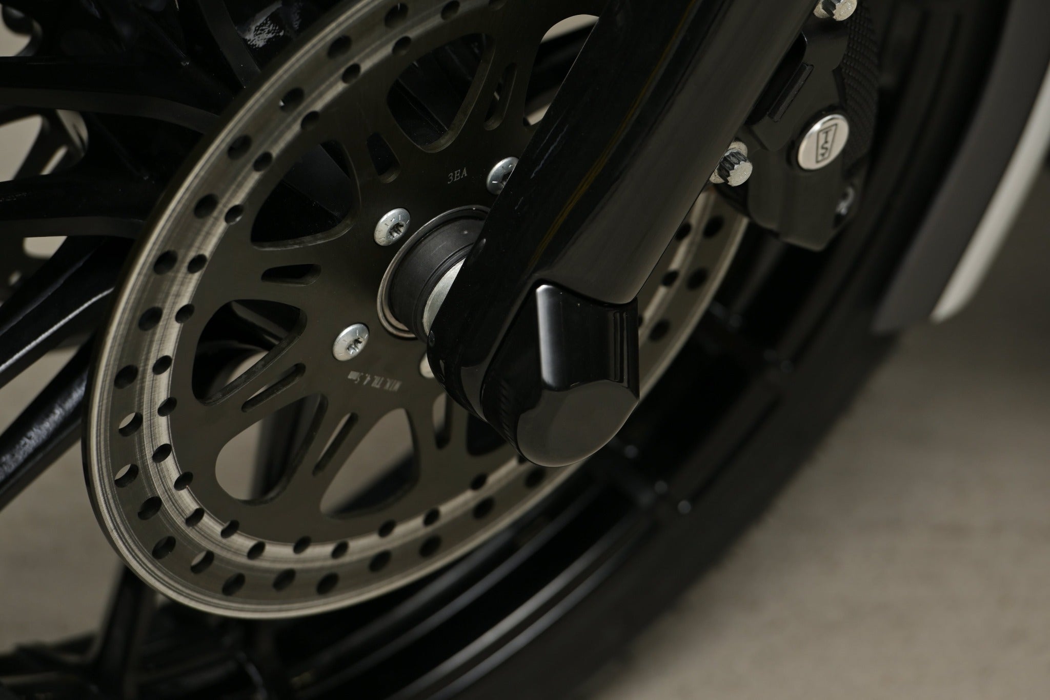 Harley Davidson Touring front axle covers on motorcycle close up