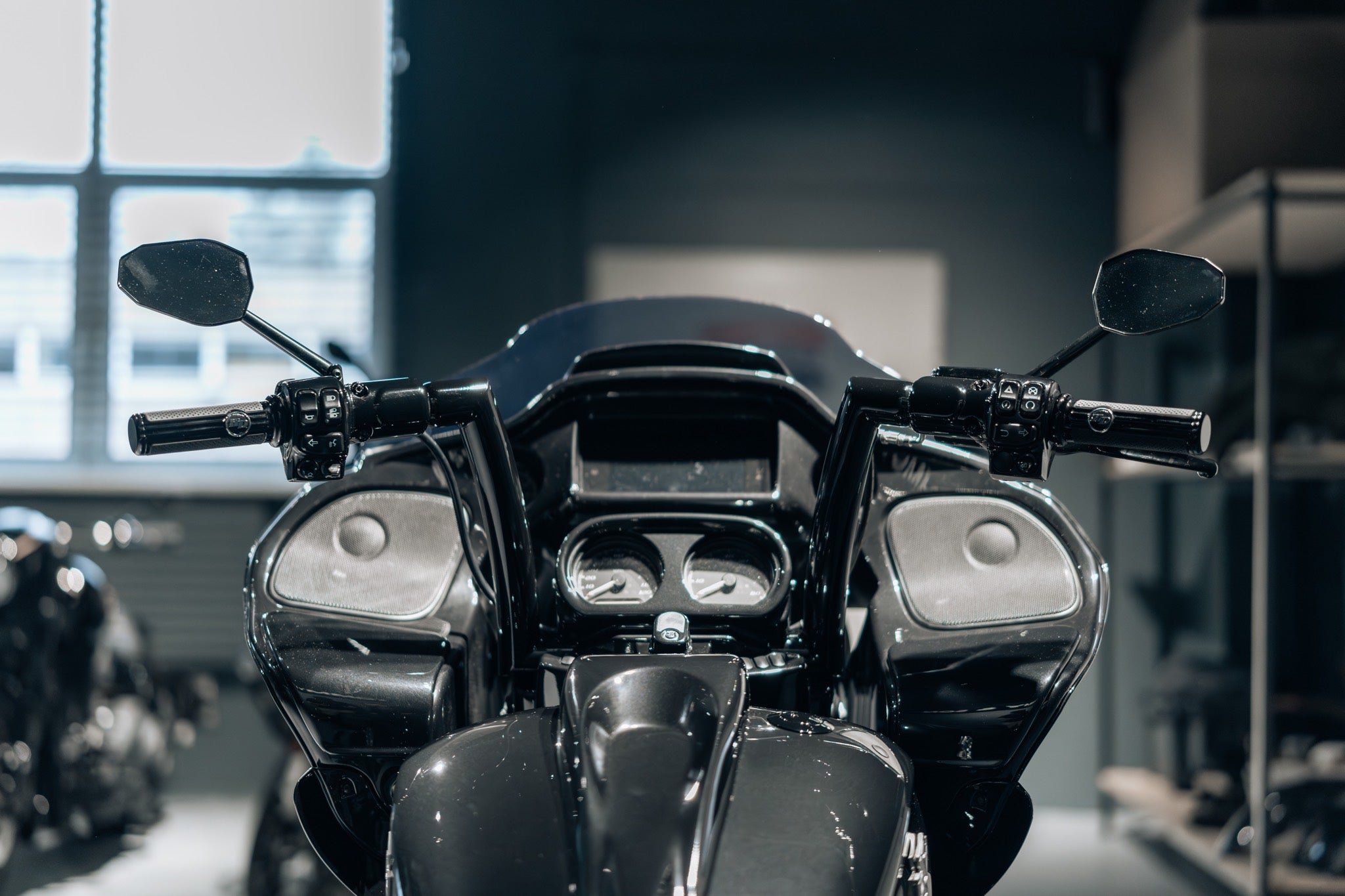 Apollo fat handlebar mounted on a black Harley Davidson Road Glide.