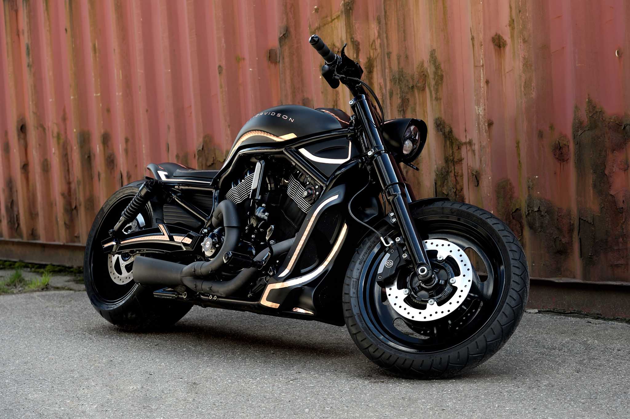 Harley Davidson V-Rod Night Rod with a custom body kit photographed from the front. The motorcycle is equipped with full Tommy&Sons photon series body kit and a ReDevoted style headlight cover.