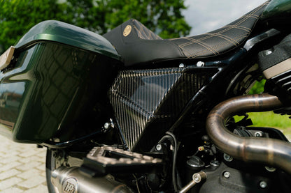 Close up shot of FXR style carbon fiber side covers for Harley Davidson
