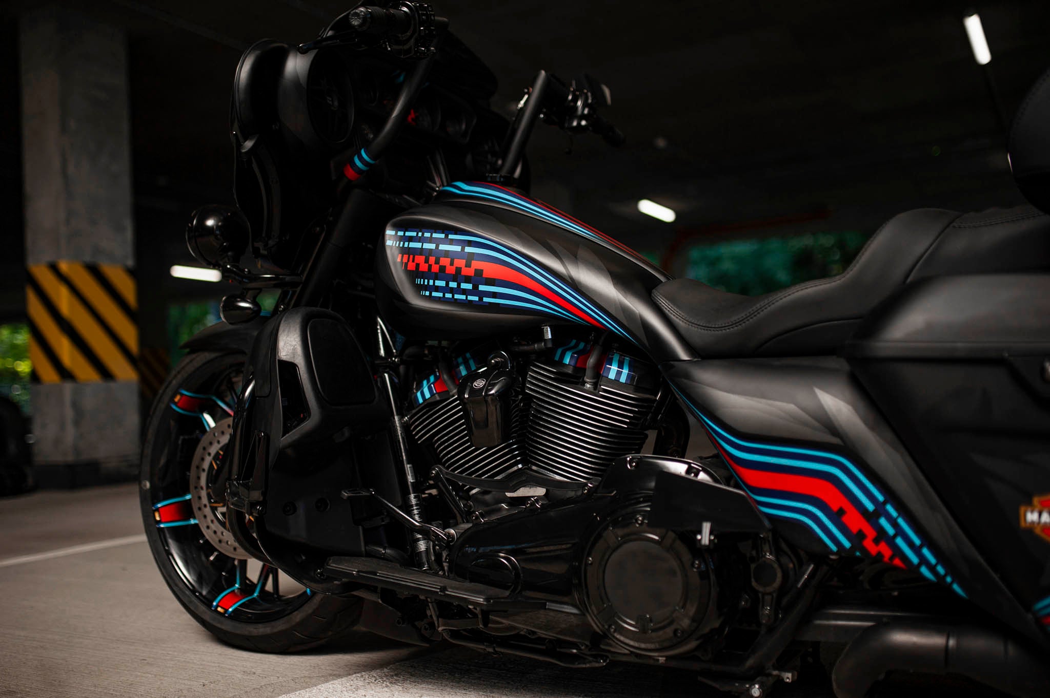 Custom celtic tank shrouds and morocco side covers made by Tommy&Sons for Harley Davidson Touring models, mounted on a 2019 Electra glide, photographed upclose from the side.