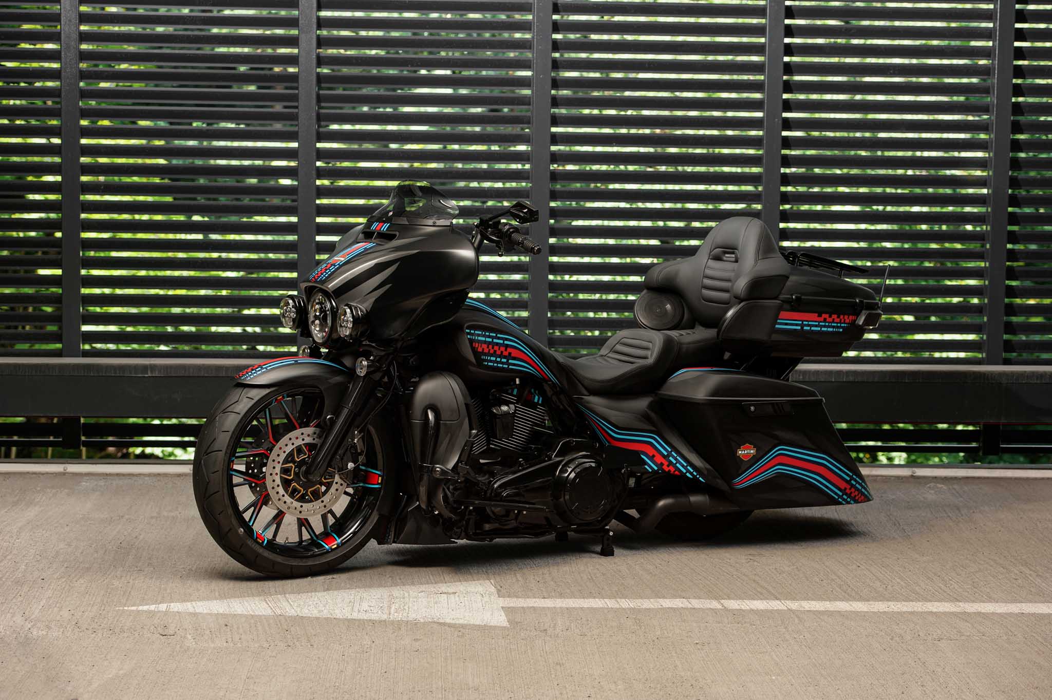 Custom Harley Davidson Electra glide 2019 with 21x5.5" front wheel and custom body kit by Tommy&Sons, photographed from the front left.