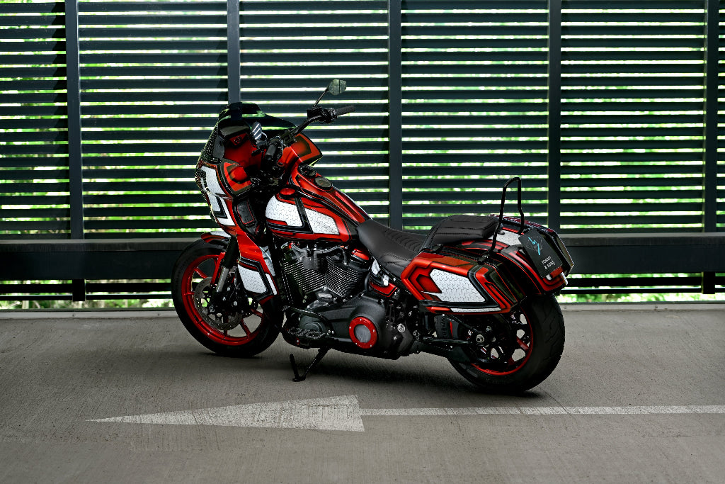 Perspective photo of the Harley Davidson Low Rider S with custom body kit by Tommy&Sons that includes custom saddlebags, floorboards, risers and Fairing with fairing lowers