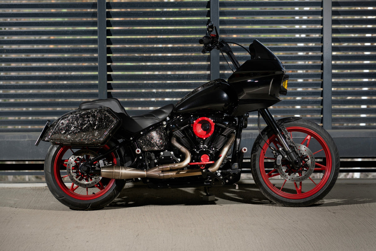 Side profile of Harley-Davidson Low Rider S fitted with Tommy&Sons Inception forged carbon fiber saddlebags and matching body panels.