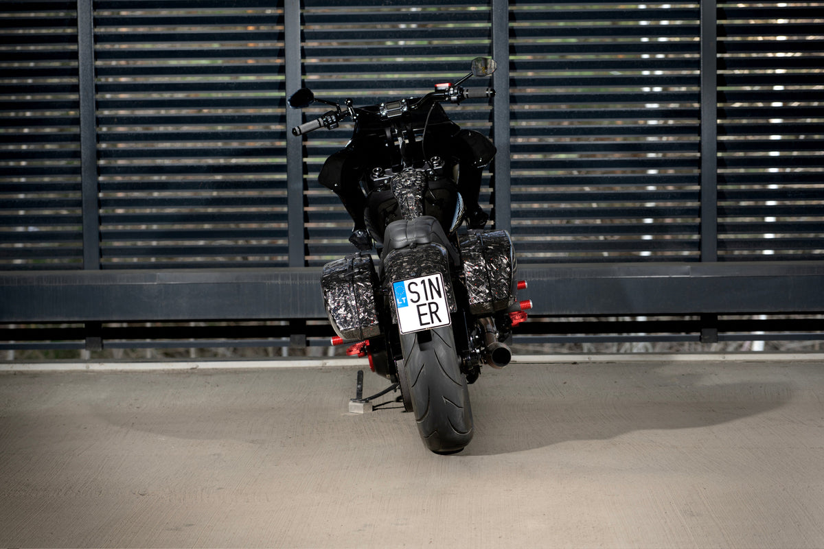 Rear view of Tommy&Sons Inception forged carbon fiber saddlebags fitted to a custom Harley-Davidson Low Rider S.